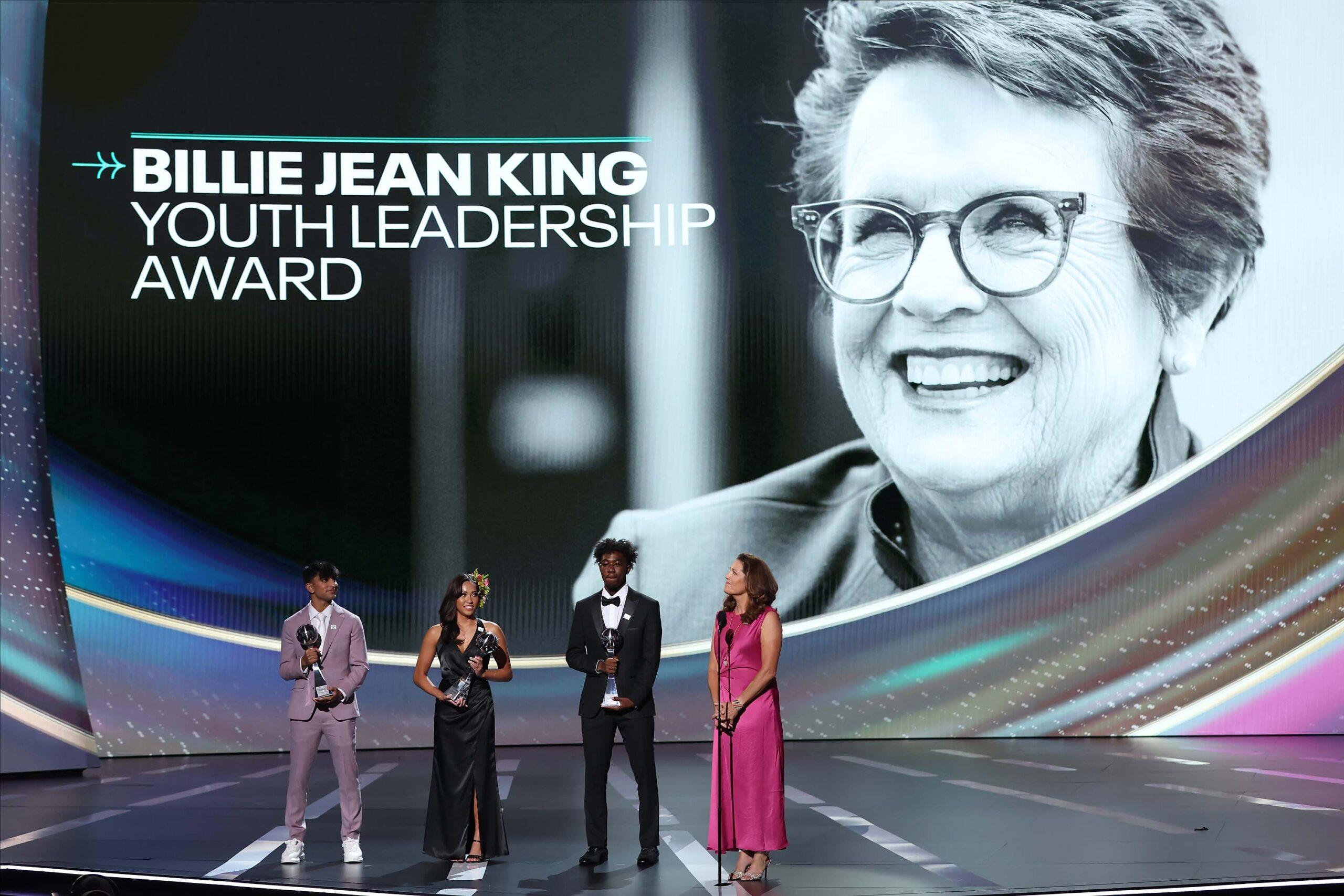 Ashley Badis, second from left, stands on stage at the 2023 ESPY Awards.